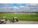 Golf driving range with golf carts, and a beautiful view of the lake at 12619 Sorrento Way, Bradenton, FL 34211