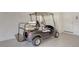 Golf cart parked inside spacious garage with epoxy flooring at 12619 Sorrento Way, Bradenton, FL 34211