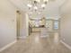 Charming kitchen featuring stainless steel appliances, tile floors, and attractive lighting at 12619 Sorrento Way, Bradenton, FL 34211