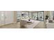 Bright living room featuring neutral colors, recessed lighting, and sliding glass doors to the outdoor patio at 12619 Sorrento Way, Bradenton, FL 34211