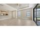 Open floor plan with tile flooring, recessed lighting, and sliding glass doors leading to the outdoor area at 12619 Sorrento Way, Bradenton, FL 34211