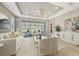 Bright living room featuring neutral colors, recessed lighting, and sliding glass doors to the outdoor patio at 12619 Sorrento Way, Bradenton, FL 34211