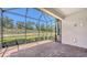 Spacious screened-in patio with brick flooring, offering a serene outdoor space and views of the backyard at 12619 Sorrento Way, Bradenton, FL 34211