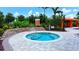 Relaxing community spa with a privacy wall and landscaping at 12619 Sorrento Way, Bradenton, FL 34211