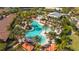 Aerial view of a resort-style pool surrounded by palm trees and lounge chairs at 12619 Sorrento Way, Bradenton, FL 34211
