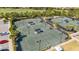 Aerial view of well-maintained tennis courts at Esplanade Golf and Country Club at 12619 Sorrento Way, Bradenton, FL 34211