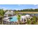 Enjoy the sunny community pool featuring a gazebo, sun loungers, and resort-style relaxation at 15172 Cuzcorro Ct, Nokomis, FL 34275