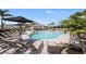 Cool off by the pool with plenty of lounge chairs and shaded areas, perfect for relaxing at 15172 Cuzcorro Ct, Nokomis, FL 34275