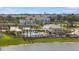 Luxury community pool with lounge seating, cabana, and a view of the lake at 15172 Cuzcorro Ct, Nokomis, FL 34275