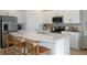 Bright kitchen boasts stainless steel appliances, granite countertops, and a spacious island at 15172 Cuzcorro Ct, Nokomis, FL 34275