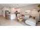 Open concept living and kitchen area featuring stainless steel appliances and modern decor at 15172 Cuzcorro Ct, Nokomis, FL 34275
