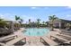 Inviting community pool with covered lounge areas and comfortable chaise lounges at 15172 Cuzcorro Ct, Nokomis, FL 34275