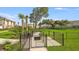 Dog park complete with pet waste station, benches, and separate areas for large and small dogs at 15192 Cuzcorro Ct, Nokomis, FL 34275
