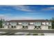 Charming townhome exterior featuring attached garages and well-manicured landscaping at 15192 Cuzcorro Ct, Nokomis, FL 34275