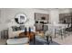 Open-concept living area with modern furnishings, a kitchen island, and recessed lighting at 15192 Cuzcorro Ct, Nokomis, FL 34275
