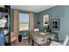 Comfortable home office with modern desk, stylish decor, and bright window view at 15196 Cuzcorro Ct, Nokomis, FL 34275