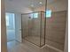 Luxurious shower featuring tiled walls and glass door in a modern bathroom at 1591 Laurel Brook Ln, Port Charlotte, FL 33953