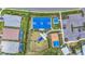 Aerial photo of the playground, basketball court, and parking area in this community at 16226 Hidden Oak Loop, Lakewood Ranch, FL 34211