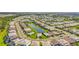 A beautiful aerial view of the neighborhood with ponds and landscaping at 16226 Hidden Oak Loop, Lakewood Ranch, FL 34211