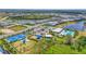 Community with a pool and community center, playground, basketball court, and lake at 16226 Hidden Oak Loop, Lakewood Ranch, FL 34211