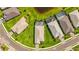 Aerial view of backyard pools in this neighborhood highlighting outdoor living spaces at 16226 Hidden Oak Loop, Lakewood Ranch, FL 34211