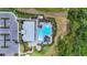 Aerial shot of the community pool, fire pit, patio furniture, and parking at 16226 Hidden Oak Loop, Lakewood Ranch, FL 34211
