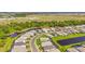 A lovely aerial view of the community featuring ponds and landscaping at 16226 Hidden Oak Loop, Lakewood Ranch, FL 34211