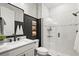 Contemporary bathroom with sleek vanity, modern fixtures, and a glass-enclosed shower for a spa-like experience at 16226 Hidden Oak Loop, Lakewood Ranch, FL 34211
