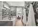Chic bathroom with designer wallpaper, frameless shower, and a soaking tub with modern fixtures and plenty of light at 16226 Hidden Oak Loop, Lakewood Ranch, FL 34211