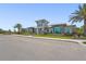Exterior shot of the community clubhouse with a landscaped entrance and street view at 16226 Hidden Oak Loop, Lakewood Ranch, FL 34211