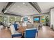 A spacious clubhouse featuring modern furnishings, a lounge area, and dining tables for social gatherings and relaxation at 16226 Hidden Oak Loop, Lakewood Ranch, FL 34211