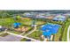 Community park features a playground, covered seating, a basketball court, and green space at 16226 Hidden Oak Loop, Lakewood Ranch, FL 34211