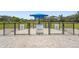 A fenced dog park with separate areas for large and small dogs, providing a safe and fun environment for pets at 16226 Hidden Oak Loop, Lakewood Ranch, FL 34211
