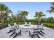 An inviting fire pit with seating, great for entertaining at 16226 Hidden Oak Loop, Lakewood Ranch, FL 34211
