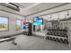 Gym featuring a variety of weights, machines, and a large mirror at 16226 Hidden Oak Loop, Lakewood Ranch, FL 34211
