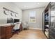 Functional home office featuring a spacious desk, comfortable seating, and ample storage, ideal for remote work at 16226 Hidden Oak Loop, Lakewood Ranch, FL 34211