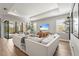 Bright living room with large sliding doors to the outdoor patio and recessed lighting at 16226 Hidden Oak Loop, Lakewood Ranch, FL 34211