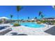 Resort-style community pool featuring comfortable seating, shaded cabanas, and meticulously kept landscaping at 16554 San Nicola Pl, Lakewood Ranch, FL 34211