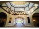 Beautiful entrance rotunda featuring a decorative ceiling and an arched doorway leading to an outdoor fountain at 17108 Vardon Ter # 401, Bradenton, FL 34211