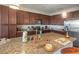 Spacious kitchen featuring granite countertops, stainless steel appliances, and ample cabinet space at 17108 Vardon Ter # 401, Bradenton, FL 34211