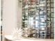 Modern wine cellar featuring glass enclosure, elegant display, and wine storage for the discerning collector at 17108 Vardon Ter # 401, Bradenton, FL 34211
