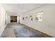 Spacious bonus room with sliding glass doors and neutral flooring at 1741 Font Ln, Holiday, FL 34691