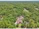 A private home with a pool surrounded by a forest of trees providing seclusion and natural beauty at 18026 Nutcracker Rd, Weeki Wachee, FL 34614