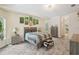 Spacious bedroom featuring stone floors, a king-size bed, and ample closet space at 18026 Nutcracker Rd, Weeki Wachee, FL 34614