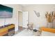 Bonus room with TV, desk, and saxophone art, perfect for a music lover or home office at 18026 Nutcracker Rd, Weeki Wachee, FL 34614