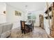 Elegant dining room featuring stylish decor and a large window overlooking the garden at 18026 Nutcracker Rd, Weeki Wachee, FL 34614