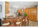 Well-equipped kitchen with granite countertops, wood cabinetry, and a breakfast bar at 18026 Nutcracker Rd, Weeki Wachee, FL 34614