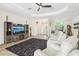 Spacious living room with tile flooring, fireplace, and stylish furniture perfect for relaxing at 18026 Nutcracker Rd, Weeki Wachee, FL 34614