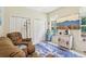 Cozy living room featuring comfortable seating, stylish decor, and a bright window at 18026 Nutcracker Rd, Weeki Wachee, FL 34614