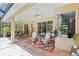 The screened-in patio area features comfortable seating and beautiful views of the pool at 18026 Nutcracker Rd, Weeki Wachee, FL 34614